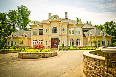 Example of a large beige three-story mixed siding exterior home design in Baltimore