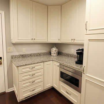 Medallion Painted White Chocolate Kitchen Cabinets with Petal Mosaic Backsplash