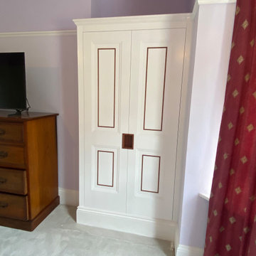 Bespoke Fitted Wardrobes with Painted Panelled Doors and Wood Inlay | Cheltenham