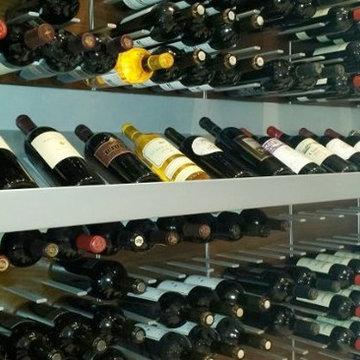 wine cellar with metal presentation shelf for magnum bottles