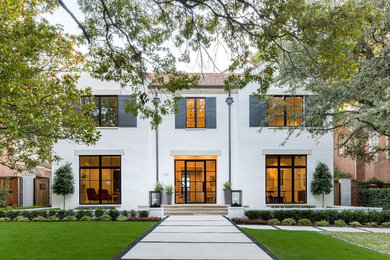 Inspiration for a transitional two-storey white house exterior in Dallas.