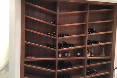 Example of a trendy wine cellar design in Calgary