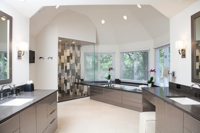 Walk-in shower - large modern master multicolored tile and stone tile ceramic tile and white floor walk-in shower idea in Chicago with flat-panel cabinets, gray cabinets, white walls, an undermount sink, quartz countertops, a hinged shower door, black countertops and an undermount tub