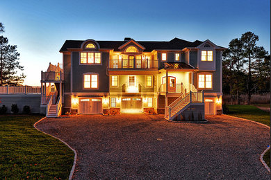 Large coastal blue three-story concrete fiberboard gable roof idea in Other