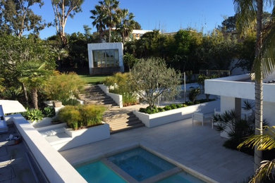 Photo of a mid-sized contemporary backyard rectangular pool in San Diego with a hot tub.