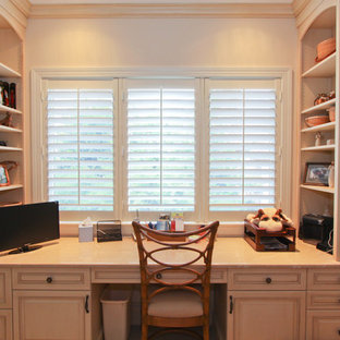 Design ideas for a world-inspired home office and library in Miami with porcelain flooring, a built-in desk and white floors.