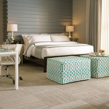 Castro Convertible Ottomans at the foot of a king size bed.