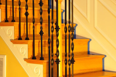 Inspiration for a mid-sized timeless wooden l-shaped mixed material railing staircase remodel in Richmond with painted risers