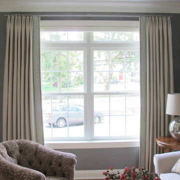 Neutral Drapery Panels with Greek Key leading edge detail.