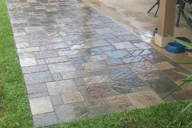 Inspiration for a small backyard concrete paver patio remodel in Houston with no cover