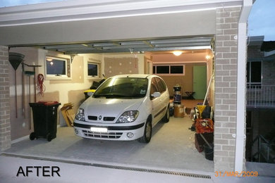 Inspiration for a mid-sized traditional attached one-car garage in Sydney.