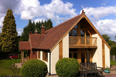 Design ideas for a white modern house exterior in Other with mixed cladding and a pitched roof.
