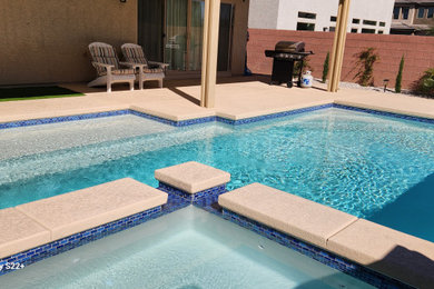 Small elegant backyard concrete and rectangular pool photo in Las Vegas