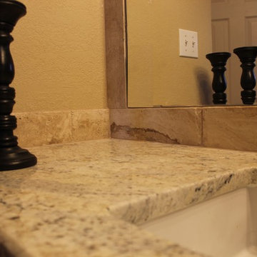 Undermount Marble Tub with Bianco Romano Granite and Frameless Shower