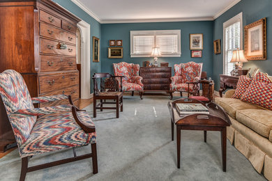 Example of a mid-sized classic enclosed carpeted and gray floor living room design in Other with blue walls