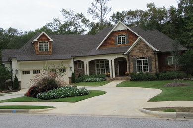 Inspiration for a mid-sized timeless brown one-story stone exterior home remodel in Atlanta with a hip roof