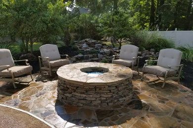 Example of a mid-sized transitional patio design in Other