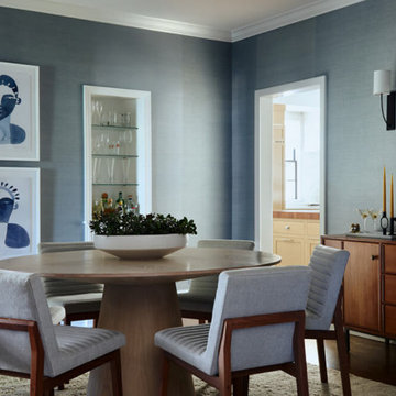 Dining Room with Upholstered Chairs and Brass Lighting