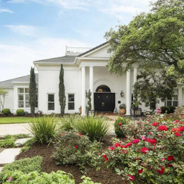 Grand Home with White Painted Brick Exterior