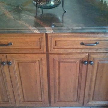 Omega Cabinetry. Destin door, Cherry wood, Nutmeg stain.