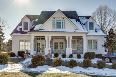 Cottage white two-story house exterior idea in Nashville
