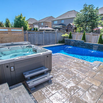 Modern Rectangle pool with water fall wall - East Oakville