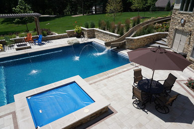 Inspiration for a large transitional backyard concrete paver and rectangular lap water slide remodel in Other