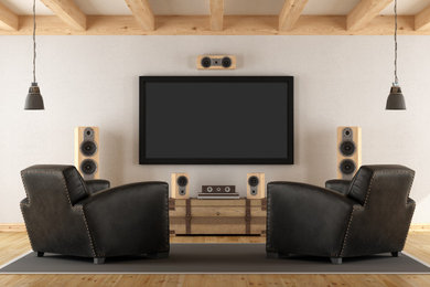 Home theater - modern home theater idea in Denver with a wall-mounted tv