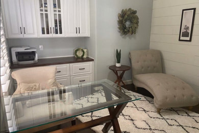Study room - small cottage freestanding desk dark wood floor, brown floor and vaulted ceiling study room idea in Dallas with green walls