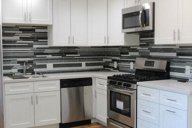 Kitchen - small modern kitchen idea in Other with quartzite countertops, multicolored backsplash, glass sheet backsplash, no island and white countertops