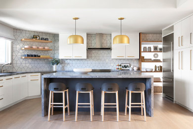Inspiration for a contemporary u-shaped kitchen in San Francisco with flat-panel cabinets, white cabinets, white splashback and grey benchtop.