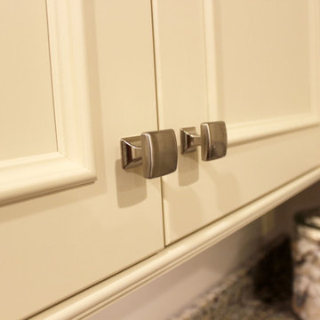 Medallion Painted White Chocolate Kitchen Cabinets with Petal Mosaic Backsplash