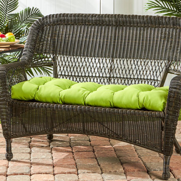 Wicker Loveseat with a Bright Green Cushion