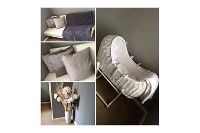 This is an example of a small modern guest bedroom with grey walls, carpet and no fireplace.