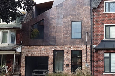 Mid-sized modern three-story metal house exterior idea in Toronto