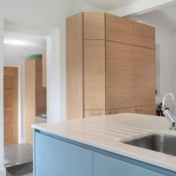 Contemporary matt blue & wood effect kitchen