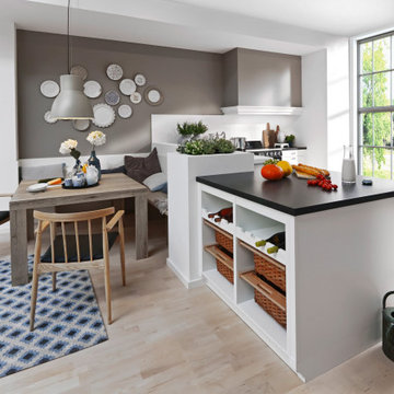 White luxury German kitchen with Island by Kudos Interior Designs
