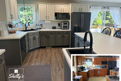 Example of a mid-sized trendy kitchen design in Grand Rapids with an island