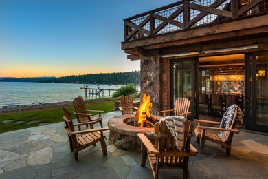Mid-sized arts and crafts backyard stone patio photo in Sacramento with a fire pit and no cover