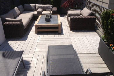 Patio - mid-sized modern courtyard patio idea in New York with decking and no cover