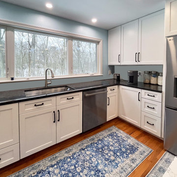 Kitchen with White Perimeter and Blue Island Cabinet Reface
