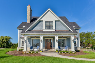 Mid-sized transitional blue two-story concrete fiberboard and clapboard exterior home idea in Chicago with a shingle roof and a gray roof