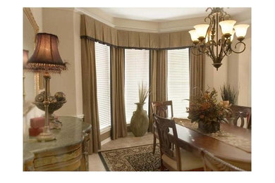 This is an example of a large traditional separate dining room in Houston with beige walls, ceramic floors, no fireplace and beige floor.