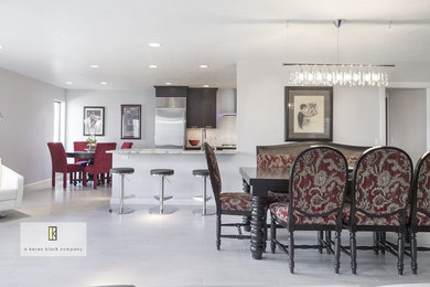 Example of a mid-sized trendy porcelain tile and gray floor kitchen/dining room combo design in Oklahoma City with white walls