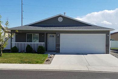 Inspiration for a mid-sized timeless gray one-story mixed siding exterior home remodel in Denver with a shingle roof