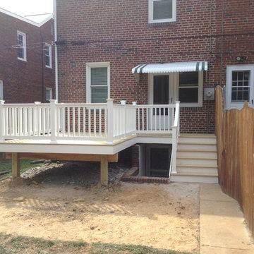 Small 12x12 Deck with walkway above basement stairs.