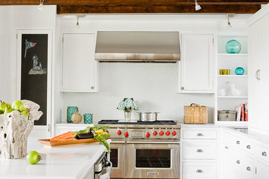 Design ideas for a beach style kitchen in Boston with marble benchtops and stainless steel appliances.