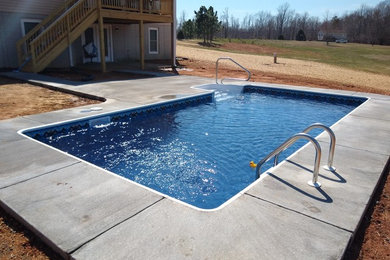 Example of a mid-sized classic backyard concrete and rectangular pool design in DC Metro