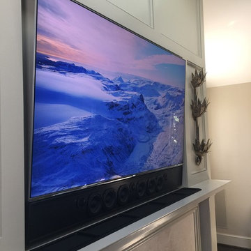 Recessed TV & Custom Soundbar over fireplace