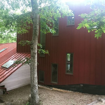 Standing seam metal roof custom pattern for new windows and layout.